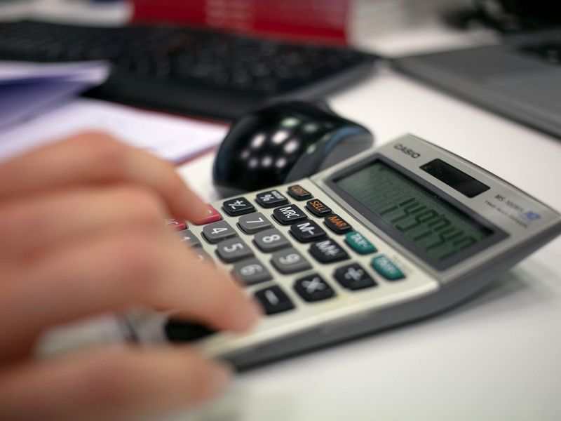 Person working at a clean desk with focus